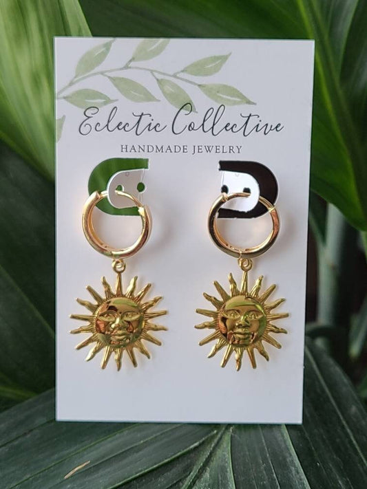 Sun with face huggie earrings