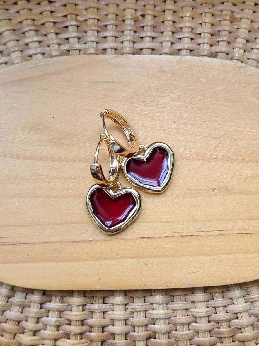 Gold plated translucent red heart huggie hoops